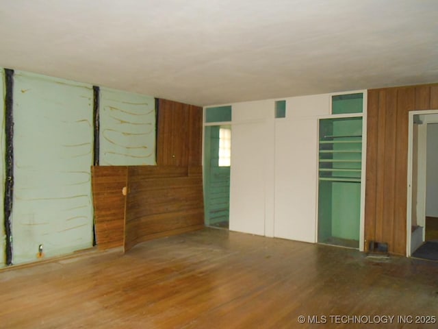 unfurnished room featuring hardwood / wood-style flooring