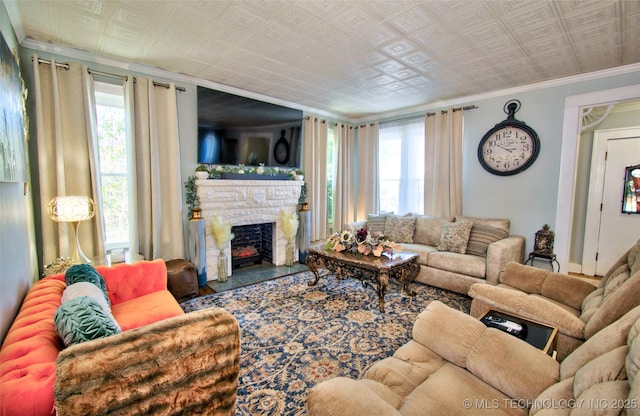 living room featuring ornamental molding and a wealth of natural light