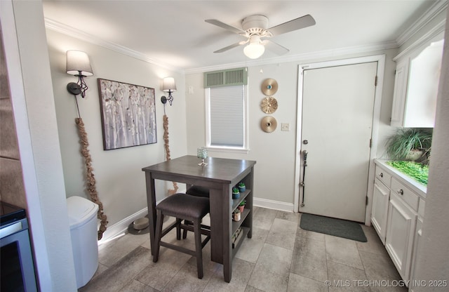 dining space featuring crown molding and ceiling fan