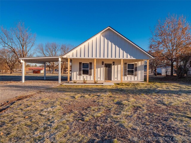 view of front of property with a carport and a porch