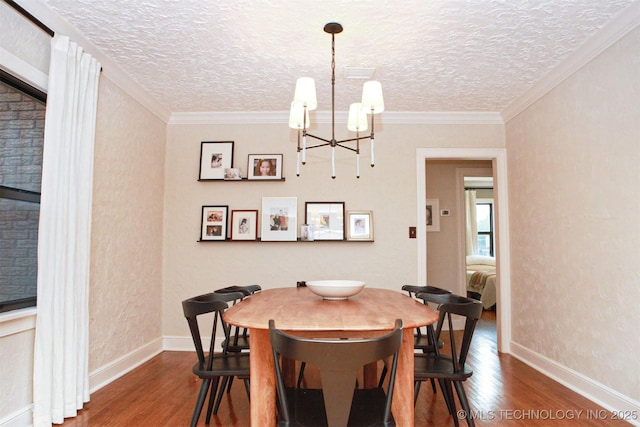 dining area featuring crown molding, dark hardwood / wood-style flooring, and a textured ceiling