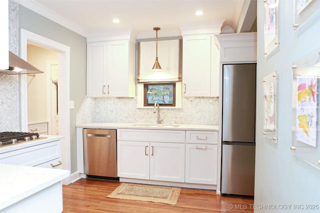 kitchen with white cabinetry, sink, and appliances with stainless steel finishes