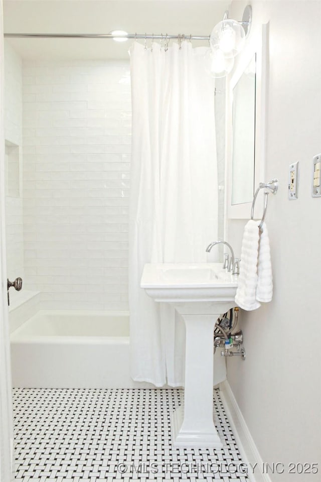 bathroom featuring tile patterned floors and shower / bath combo with shower curtain