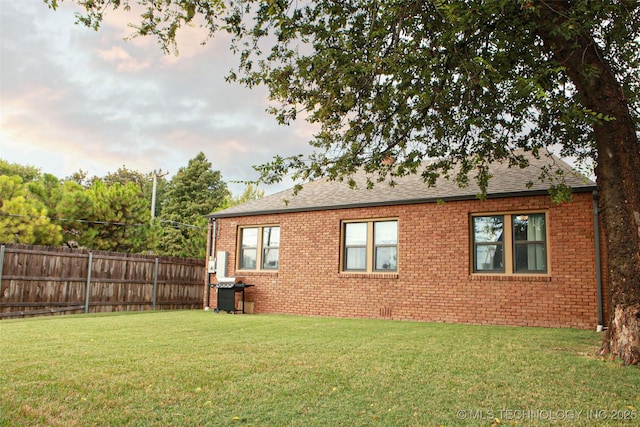 view of home's exterior with a yard