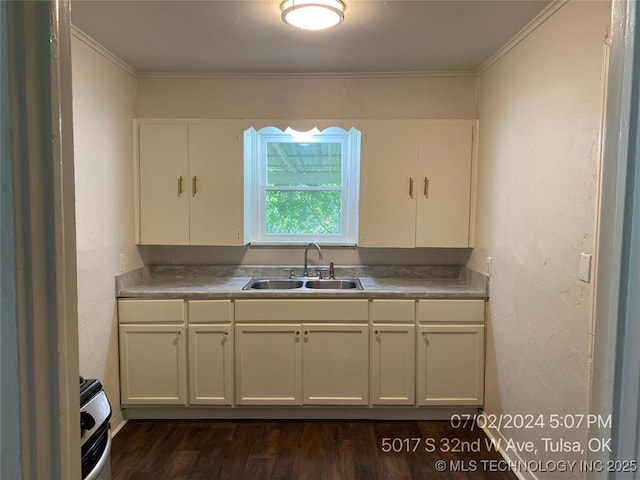 kitchen featuring sink, dark wood-type flooring, range, white cabinetry, and ornamental molding