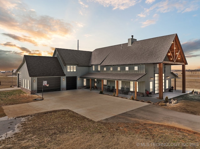 modern inspired farmhouse featuring a garage