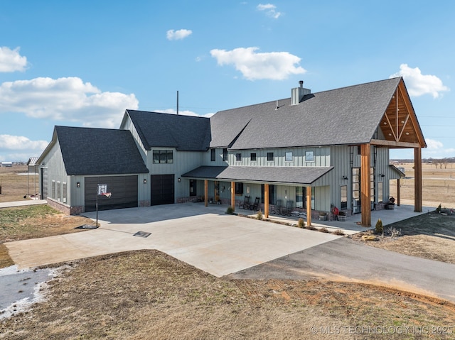 view of front of house featuring a garage and covered porch