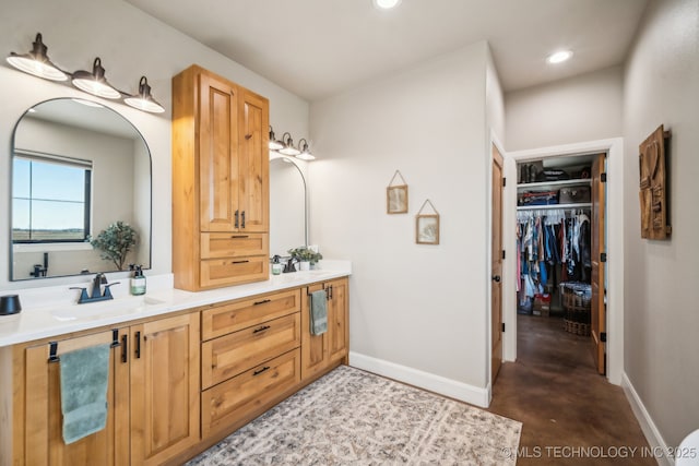 bathroom featuring vanity and concrete floors