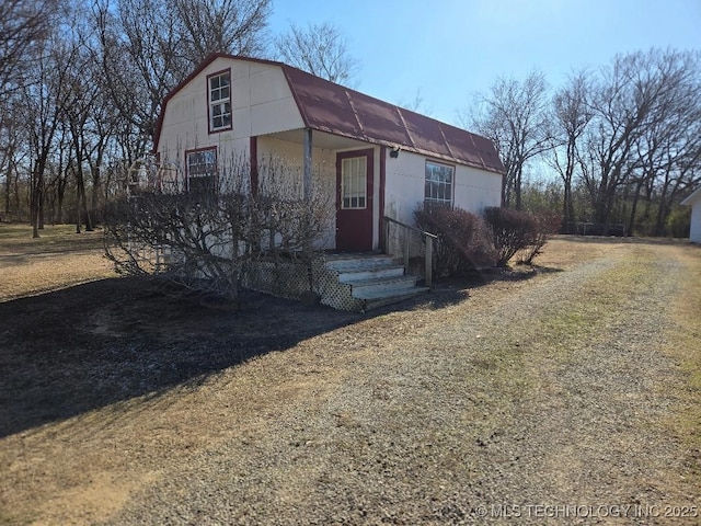 view of front of house featuring an outbuilding