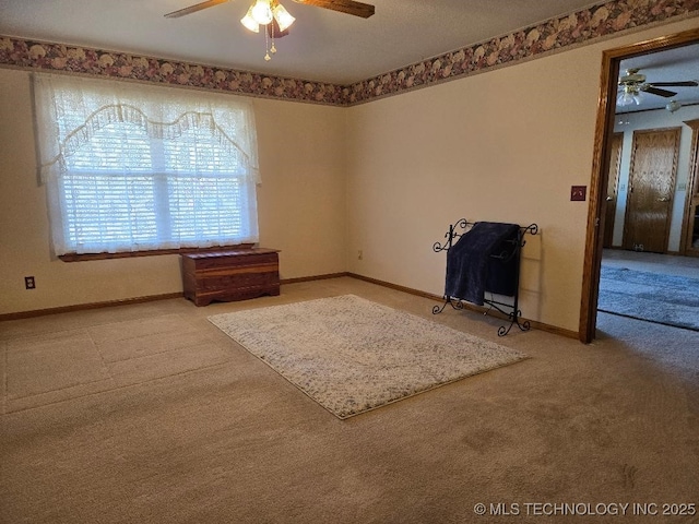 unfurnished room with carpet floors and ceiling fan