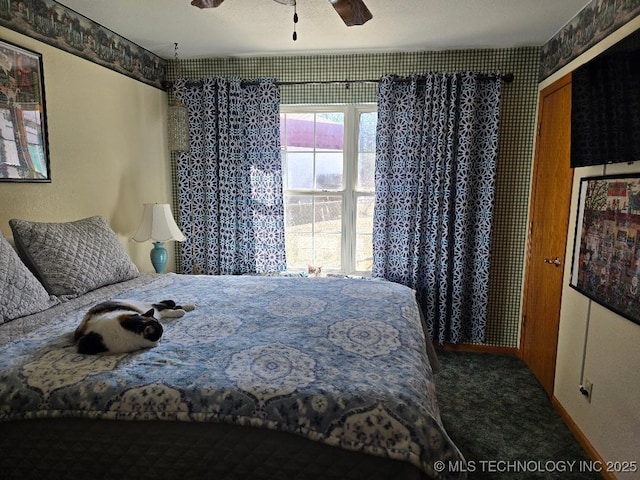 carpeted bedroom featuring a closet and ceiling fan