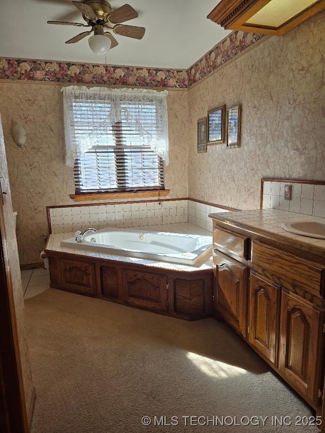 bathroom with vanity and a bath