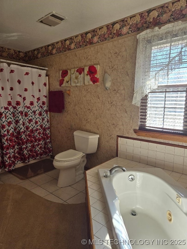 bathroom with tile patterned floors, toilet, and plus walk in shower