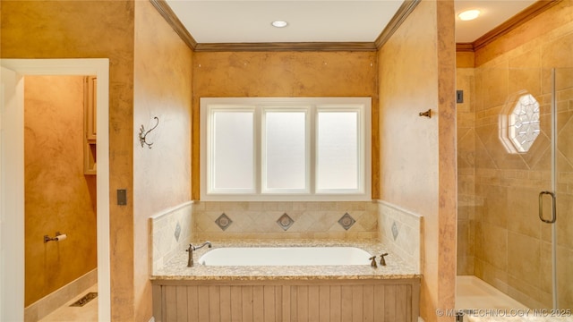 bathroom with crown molding and separate shower and tub