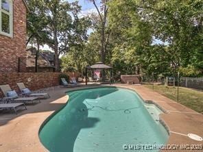 view of pool with a gazebo and a patio area