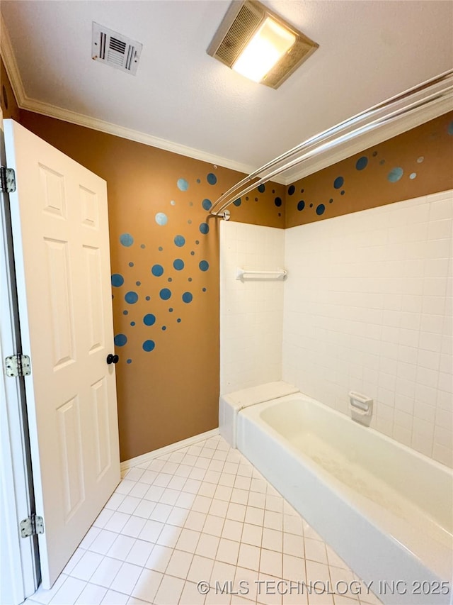 bathroom with tiled shower / bath, ornamental molding, and tile patterned flooring