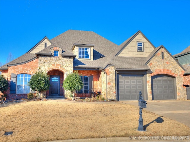 view of front of home featuring a garage and a front lawn