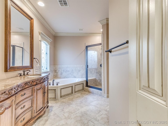 bathroom with vanity, ornamental molding, and shower with separate bathtub