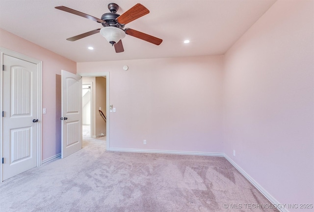 spare room with light colored carpet