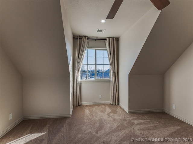 bonus room featuring ceiling fan and carpet flooring