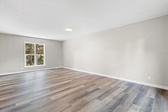 2936 Ridge Rd, Bartlesville, OK 74006 - unfurnished room with wood finished floors and baseboards