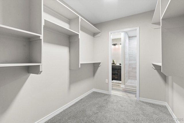 2936 Ridge Rd, Bartlesville, OK 74006 - spacious closet featuring carpet