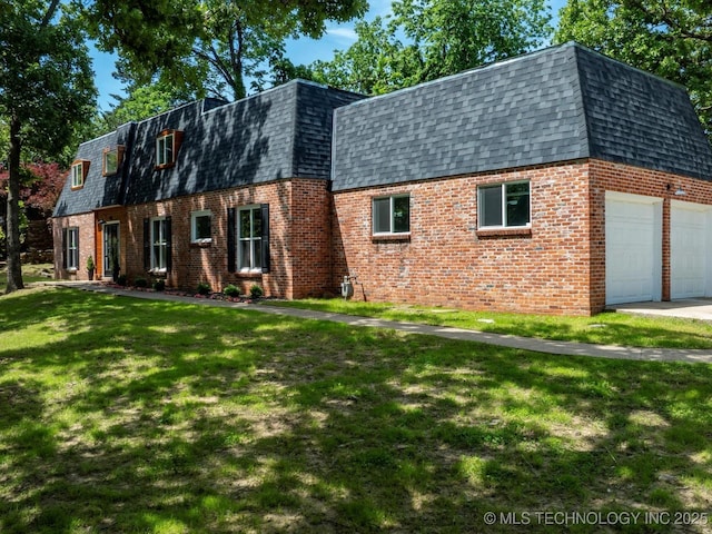 2936 Ridge Rd, Bartlesville, OK 74006 - dutch colonial featuring mansard roof, a shingled roof, and brick siding