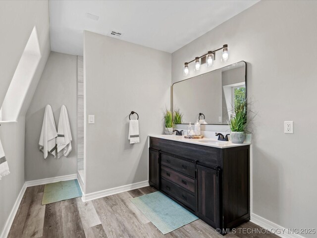 2936 Ridge Rd, Bartlesville, OK 74006 - bathroom with wood finished floors and double vanity
