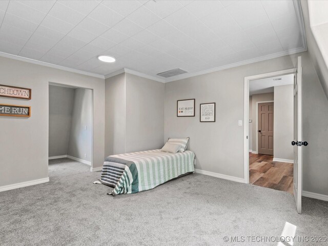 2936 Ridge Rd, Bartlesville, OK 74006 - carpeted bedroom featuring ornamental molding and baseboards