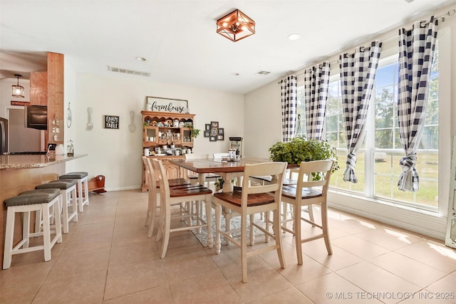 dining space with light tile patterned floors