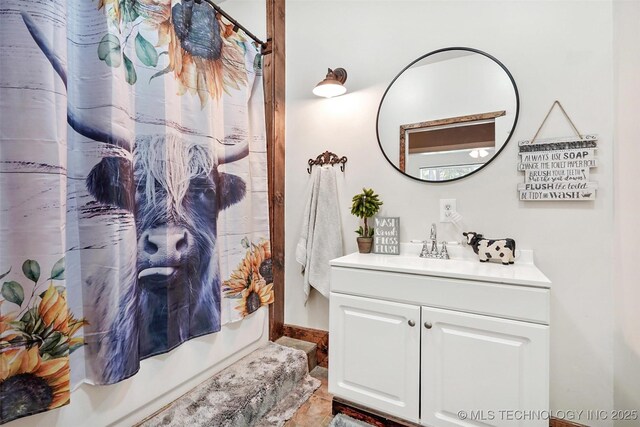 bathroom with shower / bathtub combination with curtain and vanity