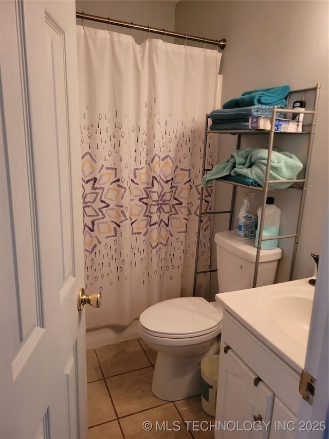 bathroom with tile patterned flooring, vanity, toilet, and a shower with shower curtain