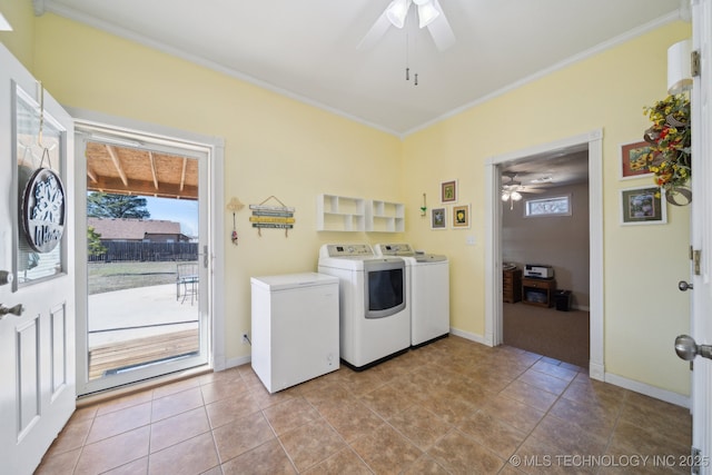 washroom with light tile patterned floors, ornamental molding, independent washer and dryer, and a healthy amount of sunlight