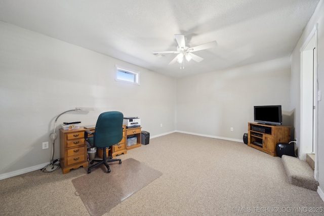 home office with ceiling fan and carpet