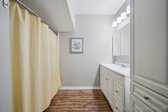 bathroom with vanity and hardwood / wood-style floors