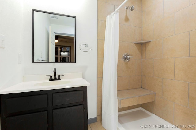 bathroom with vanity and a shower with shower curtain