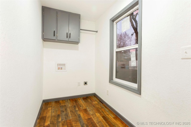 laundry area featuring hookup for a washing machine, dark hardwood / wood-style floors, cabinets, and hookup for an electric dryer