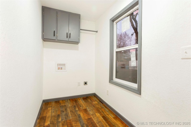 laundry area featuring cabinet space, washer hookup, hookup for an electric dryer, dark wood-style flooring, and baseboards