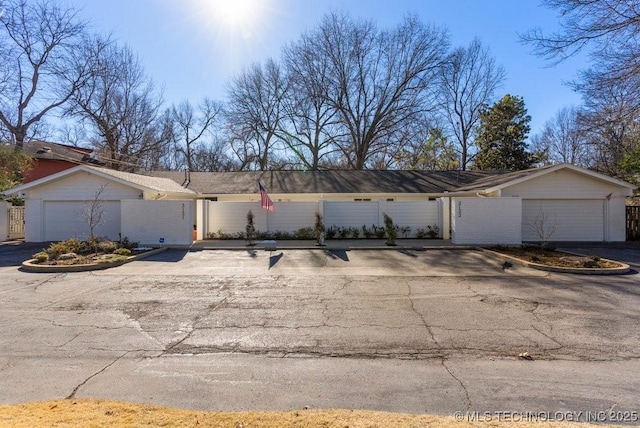 single story home with a garage