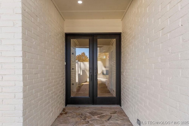 property entrance featuring french doors