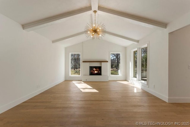 unfurnished living room featuring lofted ceiling with beams, wood-type flooring, and a chandelier