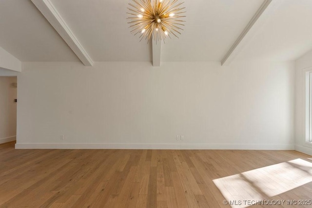 unfurnished room with a notable chandelier, beam ceiling, and light hardwood / wood-style flooring