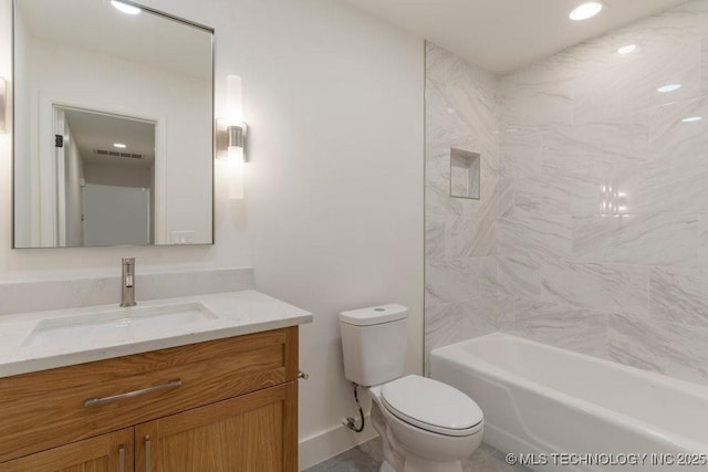 full bathroom featuring vanity, toilet, and tiled shower / bath combo