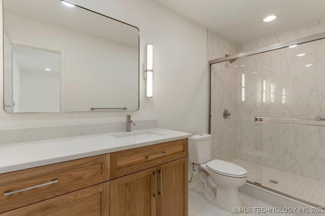 bathroom with tile patterned flooring, vanity, toilet, and walk in shower