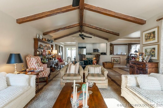 living room featuring lofted ceiling with beams and a wealth of natural light