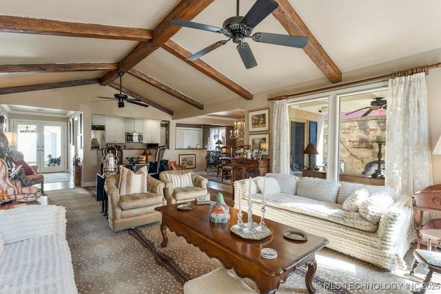 carpeted living room featuring ceiling fan and lofted ceiling with beams