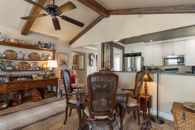 sitting room featuring vaulted ceiling with beams and ceiling fan