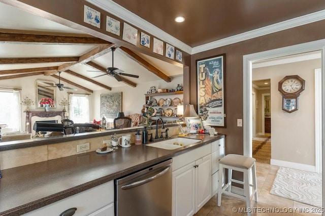 kitchen featuring lofted ceiling with beams, white cabinetry, dishwasher, sink, and light tile patterned floors