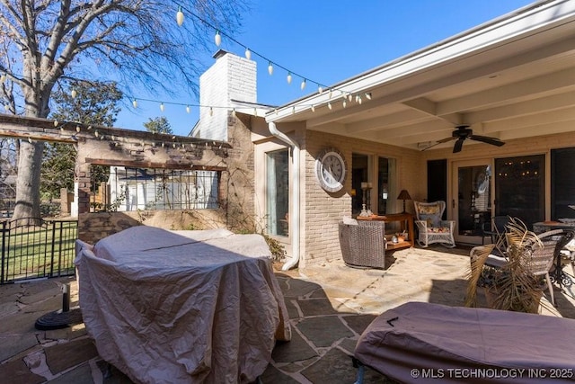 view of patio / terrace featuring ceiling fan