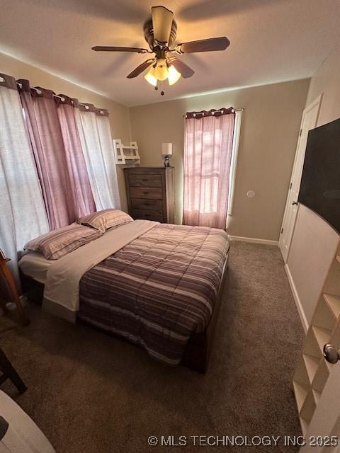 carpeted bedroom featuring ceiling fan